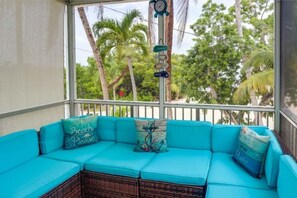 Screened-in porch with waves rolling behind you.  Add book and favorite drink.