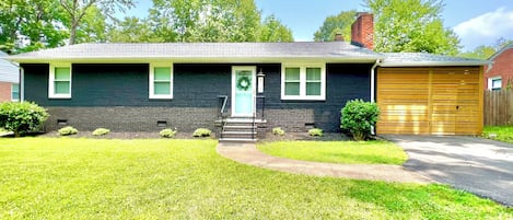 Crieff Cottage is a Charming brick ranch with modern farmhouse style, with view of Enclosed Covered Patio. 