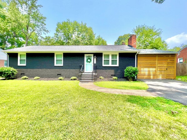 Crieff Cottage is a Charming brick ranch with modern farmhouse style, with view of Enclosed Covered Patio. 