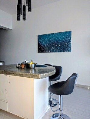 View of the kitchen island taken from the couch.