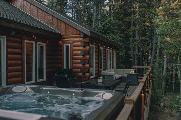 Private deck holds hot tub, infrared grill, outdoor seating & dining
