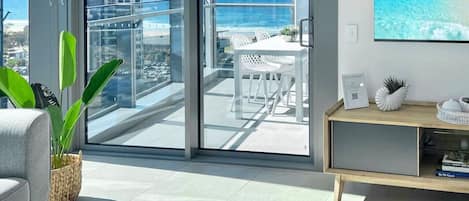 Balcony and living area with ocean views