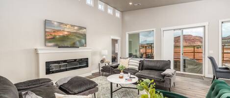 Beautiful, airy living room w/electric fireplace and smart tv