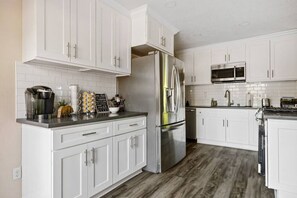 Fully stocked remodeled kitchen with everything you need to make a memorable meal.