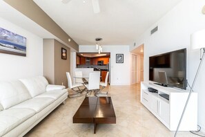 Apartment has 1623 sq/ft. and living room features 65' smart TV.