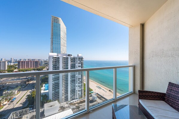 Enjoy stunning balcony views of the vibrant cityscape and twinkling skyline.