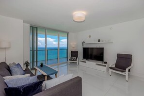 Relax in the comfortable living room with breathtaking ocean views.
