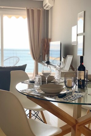 Dining Area Setup – Enjoy Meals Indoors with Ambient Lighting and Window Views

