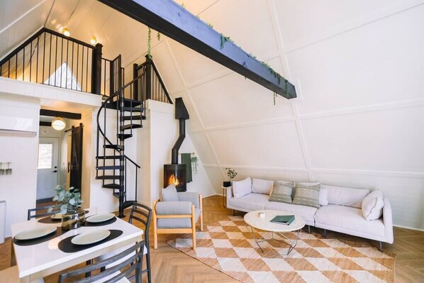 Open concept living room with smart tv and fireplace