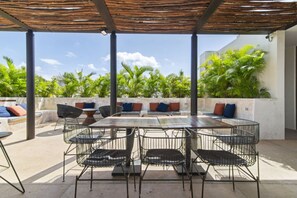 Shared rooftop with views and cozy seating—ideal for lazy afternoons.