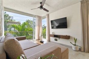 Cozy lounge with smart TV—perfect for relaxing after Tulum adventures.