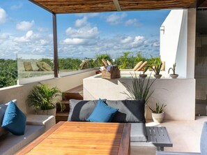 Rooftop with pergola and views of Tulum and La Veleta neighborhood.
