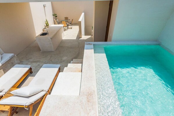 Spacious private rooftop with multiple areas to relax and hang out.