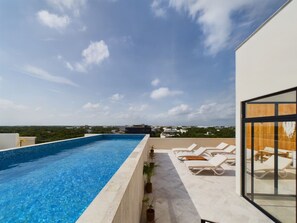Indulge in luxury at Giada Towers’ rooftop pool with stunning 360° views.