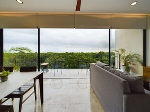 Stylish living room with panoramic views and peaceful vibes.