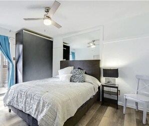 Master bedroom with private full bathroom and smart TV.
