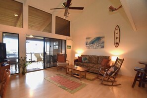 Open floor plan with cathedral ceiling