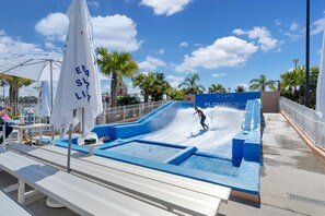 Craving some surf action? The resort's surfing simulator brings the waves to you. Hang ten!
