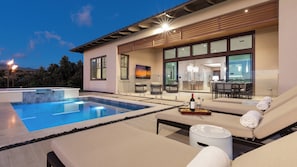 Enjoy evenings by your private pool or covered lanai with 85" TV.