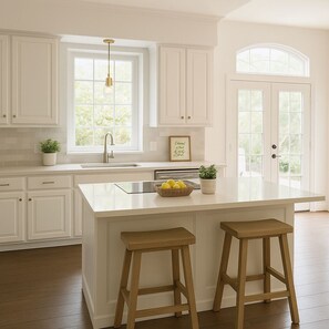 Bright, open kitchen with bar seating.