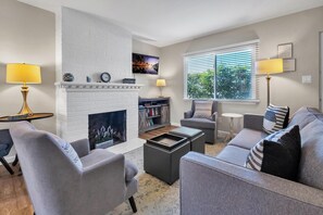 Living room: sofa, two chairs, TV

The fireplace is to not be utilized.