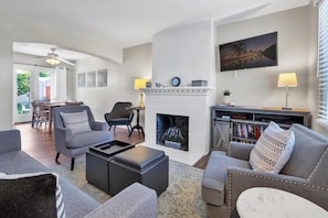 Living room: sofa, two chairs, TV
The fireplace is to not be utilized.