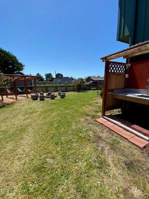 Outdoor Fish & Clam cleaning station and hammocks in the back!