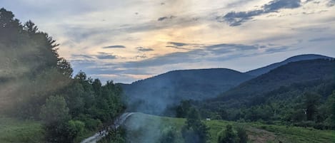 Enjoy the mountain view while sitting by the fire pit.