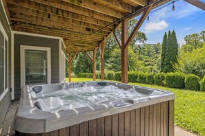 Enjoy a hot tub on the lower patio and views from the upper balcony.