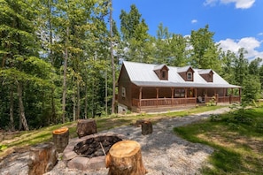 Outdoor fire pit and covered front porch.