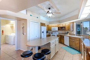 Fully equipped kitchen with ample space to cook and dine.
