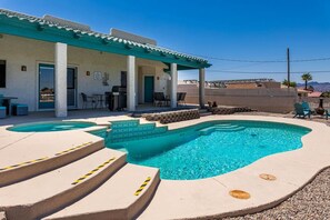 Relax by the sparkling pool under the sun.