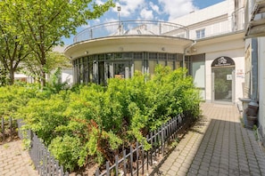 Greenery around the building. 