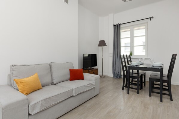 Living room with a comfortable sofa and TV.