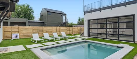 Outdoor space built for entertaining! Heated pool | Games | Lounge Chairs | Ping pong table | Rooftop patio | and more!