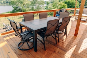 Outdoor dining on the sun shaded deck.