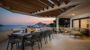 Private balcony of Croatia luxury pool villa with sea view and seating area for vacation and rent