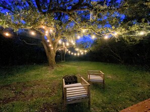 The oak tree under the lights is the perfect spot to unwind after exploring!