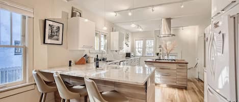 The Monroe Bungalow boasts tons of natural sounth facing light and chefs kitchen