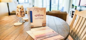 Guest book with custom welcome/info magazine