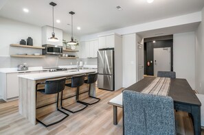 Open concept living, dining and kitchen area