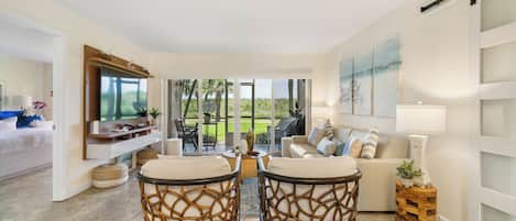 Cozy living room with view of the lanai and Dunes.