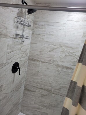 Bathroom has walk-in shower.