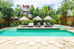 Beautiful pool nestled in nature with refined design