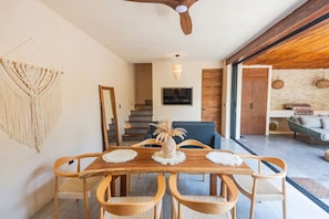 Stylish living area with natural light, handcrafted décor, and cozy comfort.