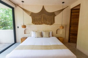 Boho-inspired king bedroom with minimalist design and wooden accents.