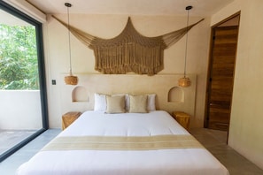 Boho-inspired king bedroom with minimalist design and wooden accents.