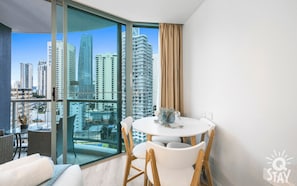 Dining area is right next to the balcony in the second room