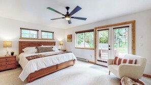 Master Bedroom with private bathroom and soaking tub. French doors lead out to hot tub.