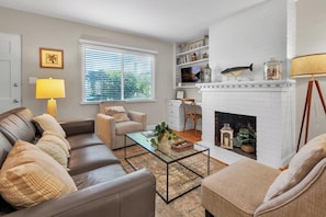 Living room: sofa, two chairs, desk with chair, TV

The fireplace is to not be utilized.